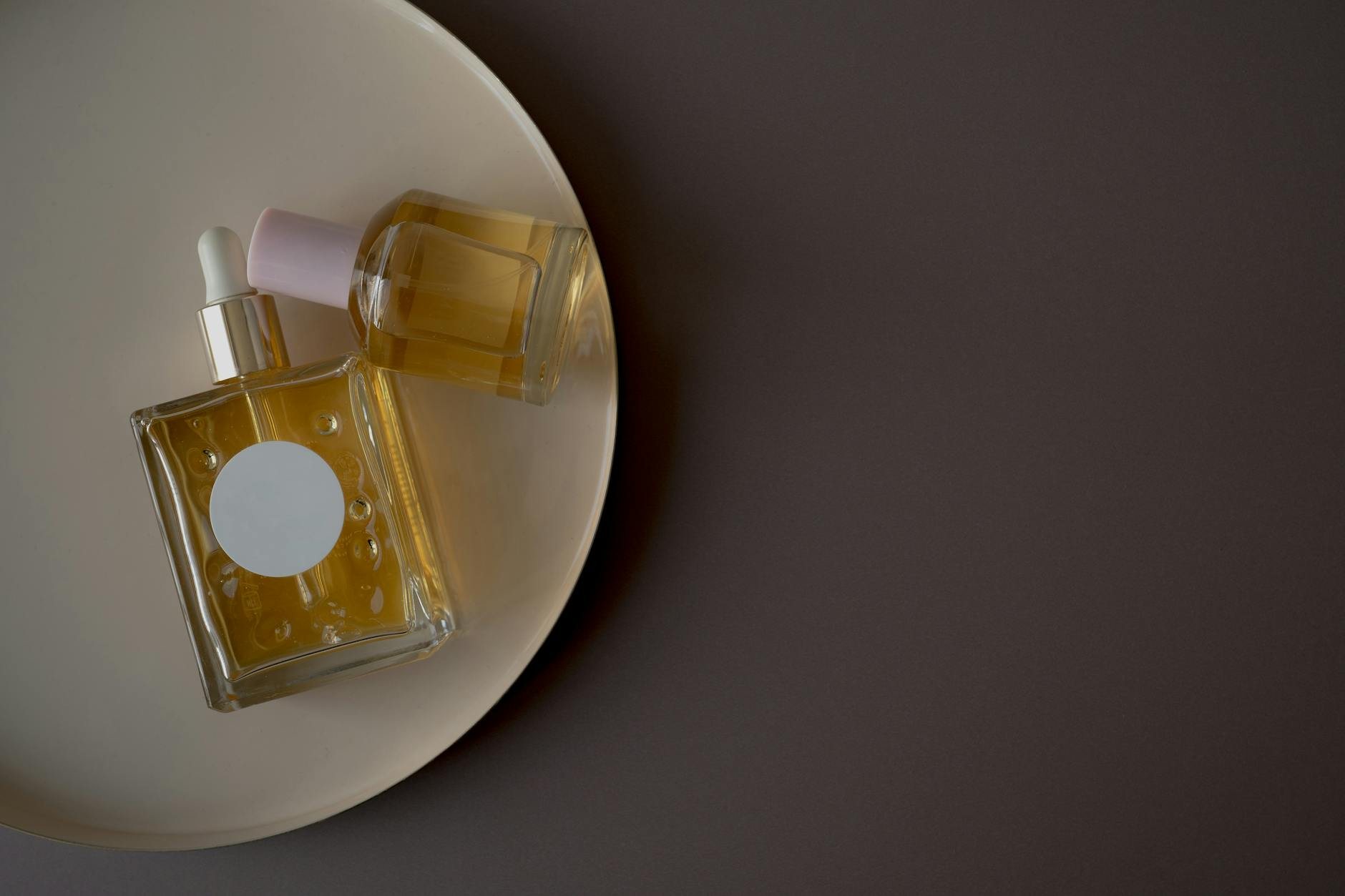 Curated vanity styling with arranged perfume bottles and parabet display